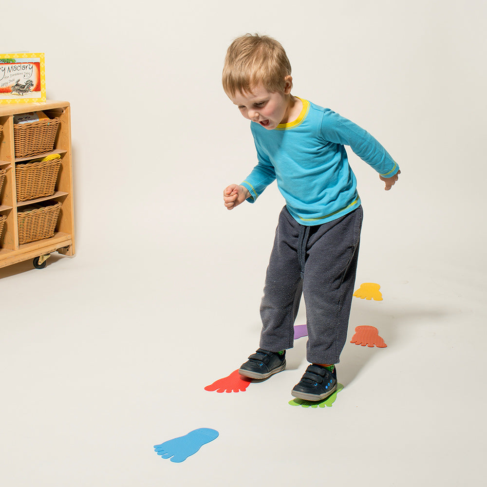 Child stepping on colourful Foot Marks – balance and coordination activity for EYFS | edx education® UK