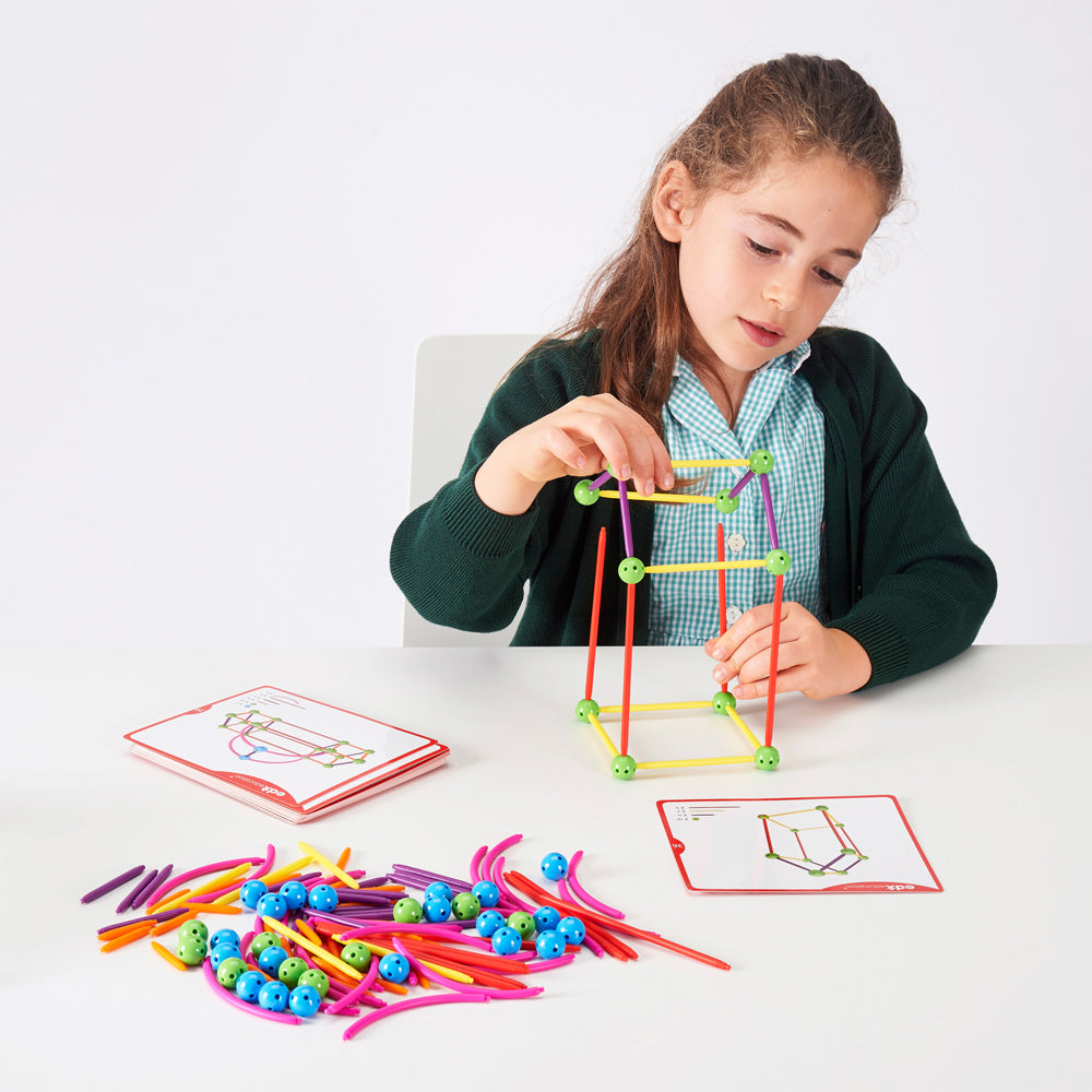 Child building 3D geometric shapes with Skeletal Geo Set – STEAM activity for EYFS | edx education® UK