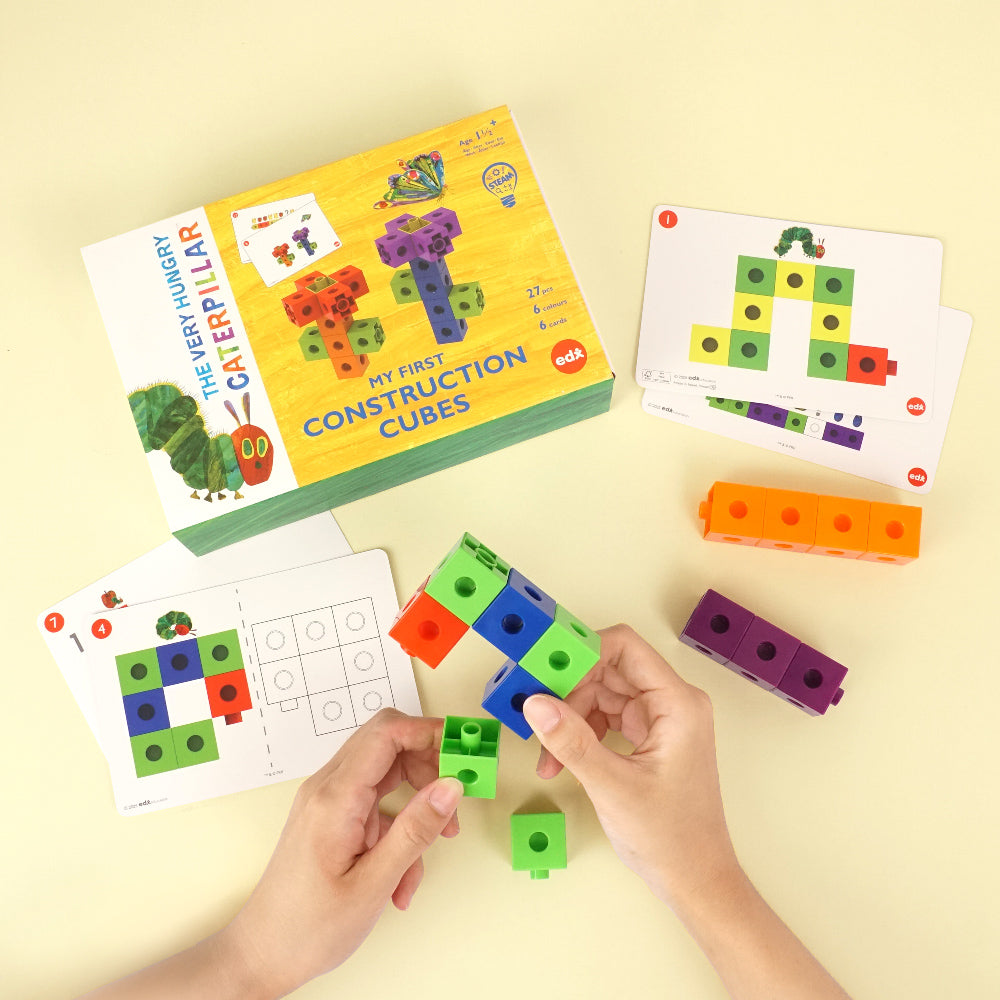 The Very Hungry Caterpillar™ My First Construction Cubes –shown with activity cards and colorful interlocking cubes for educational STEM learning.