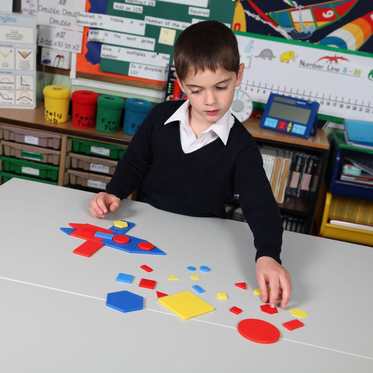 Child sorting Attribute Blocks by shape size and colour – EYFS maths activity | edx education® UK